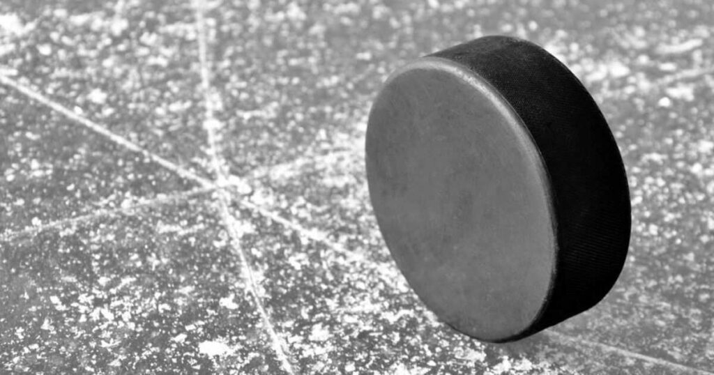 Height of Two Hockey Pucks
